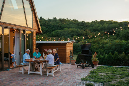  A family enjoys dinner on their patio in one of the best places for a second home. 