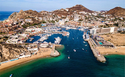 The coastline of Los Cabos features beach resorts and mountains, a favorite family vacation spot in Mexico.