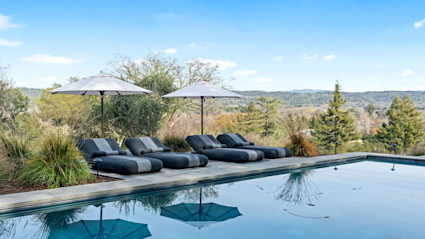 A luxurious poolside setting at a Sonoma winery highlighting relaxation and the casual sophistication of the region.