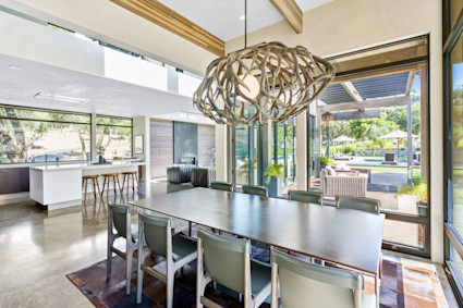 Bright dining space with a statement chandelier and plenty of sunlight, ideal for enjoying seasonal wine country meals in Sonoma.