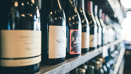 A display of premium Napa wine bottles, emphasizing the region’s wine scene and its significance at festival events.