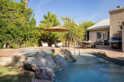 A tranquil private pool and patio in La Quinta, CA, representing the peaceful and exclusive lifestyle available during the fall shoulder season.