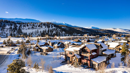 An aerial perspective of Breckenridge showcases how luxury retreats are nestled among mountain landscapes and near exceptional hiking trails.