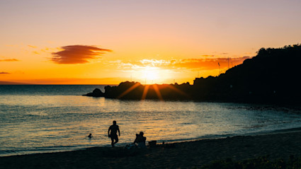 Sunset on a Maui beach highlights the easy flow from ocean to lanai living that a well located second home provides.