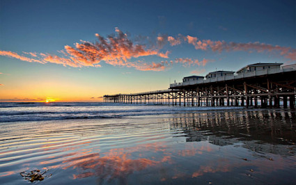 A photo shows a pier at Pacific Beach, one of the best neighborhoods in San Diego.