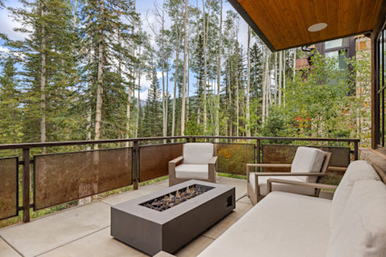 The outdoor patio at Mountain Village offers a gathering spot for evenings by the fire—ideal for reflecting on festival highlights with friends under Telluride’s starlit sky.