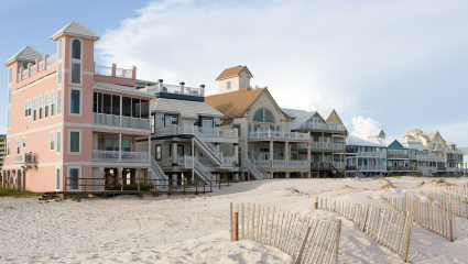 Houses line the beach of Gulf Shores, Alabama, embodying why it’s one of the best places for a second home.