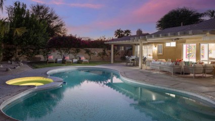 A pool at a La Quinta second home during the evening