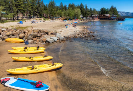 Kayaks line the shore of Lake Tahoe