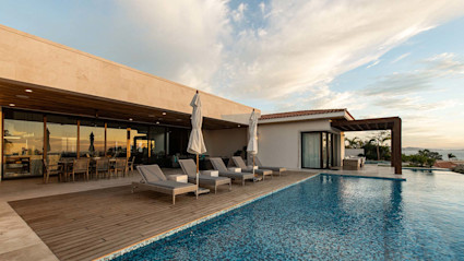 Exterior pool view of a luxury vacation home in Cabo, Mexico.
