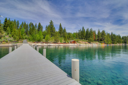 The blue water surrounded by green forests exemplifies why Lake Tahoe is one of the best family vacation spots in the country.
