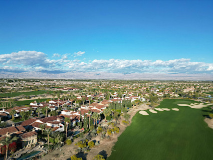 Aerial view of La Quinta’s golf corridors, highlighting proximity between residential areas and PGA WEST for easy access during tournament week.