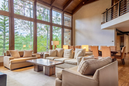 Crystal's beamed ceiling and sun-filled living room create an elegant space for hosting after-festival gatherings or enjoying downtime in Telluride.