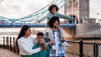 A happy family enjoys their time in London.