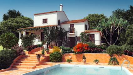 A beautiful villa with a pool and lush garden, suggesting a higher average vacation cost for a luxury trip.