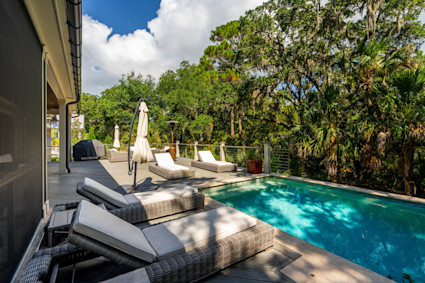 Private saltwater pool and outdoor lounge area at Eugenia on Kiawah Island, an ideal space for relaxation.