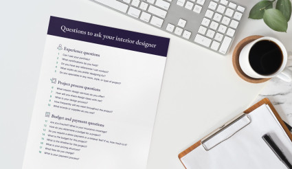 A list of questions to ask a potential interior designer on a desk, including how much the interior designer costs.