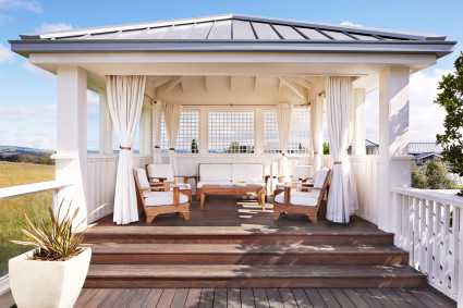 white and blue Gazebo with outdoor furniture