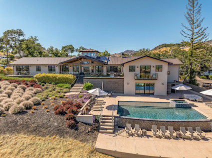 Loma Vista in Napa features serene poolside views and an expansive entertaining area, perfect for relaxing between festival events or hosting after-concert gatherings.