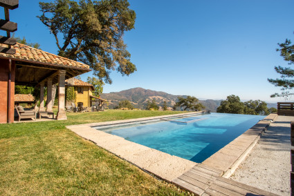 Estate pool with two homes and mountain view