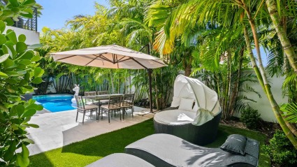 Backyard pool and tropical garden at a Miami second home