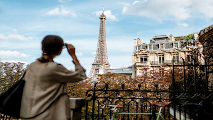 Paris street view toward the Eiffel Tower underscores how setting elevates daily routines and remote work focus.