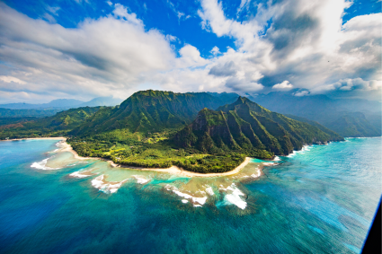 Aerial view of a green Hawaiian island and ocean