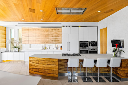 Marine Lair in La Jolla showcases a sleek, open kitchen that extends to outdoor entertaining areas, a hallmark of San Diego's chef-centered lifestyle.