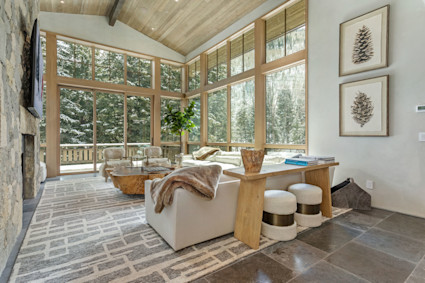 A sunroom at Meadows offers a peaceful refuge that echoes the harmony and relaxation inspired by the Bravo Vail Music Festival. After an evening performance, this serene space provides the perfect setting to reflect and connect with the spirit of the event.