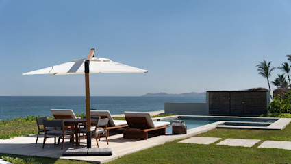 Beachfront lounge vibes set the tone for relaxed evenings after early tee times, a hallmark of the Cabo golf lifestyle.