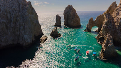 A photo shows the waters and cliffs outside of a luxury Cabo hotel. 