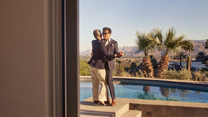 Older couple dancing together in their second home