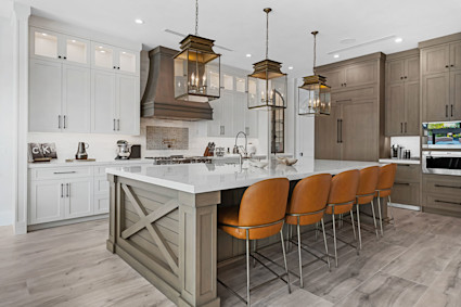 Coconut Isle features a modern chef’s kitchen and open layout that flow to the canal-side pool and private dock, ideal for Intracoastal boating days and hosting after sunset.