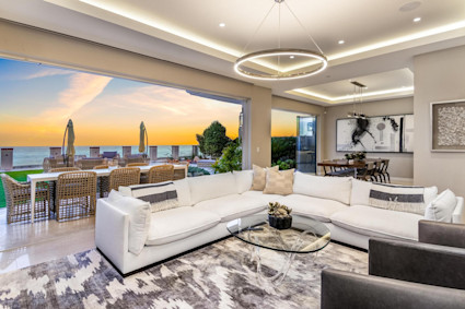 Neptune Bluffs in Encinitas showcases indoor-outdoor flow and a flexible great room, ideal for hosting game nights and oceanfront gatherings.