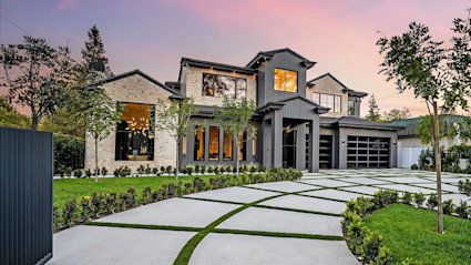 Image of a luxury second home at dusk. 
