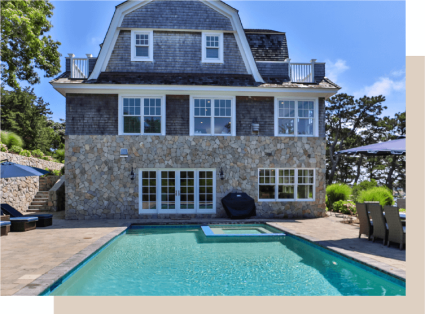 An image displays a traditional Cape Cod home, one of the main types of houses.