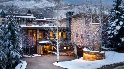 Outside of a second home in Vail during winter close to ski run trails