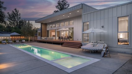 modern farmhouse exterior with pool