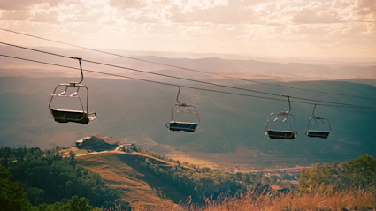 A view from the Steamboat Gondola at sunset sets the stage for evenings at Thunderhead Lodge, blending the excitement of Steamboat Springs events with the tranquility of mountain living.