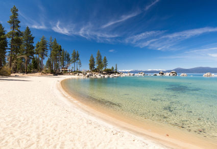 A white sandy beach on the shore of Lake Tahoe.