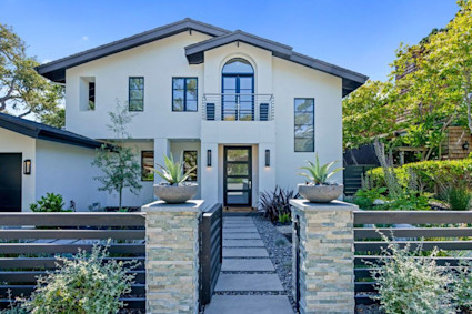 Dolores in Carmel brings Mediterranean cues like stucco and balconies into a coastal setting with open-plan living.