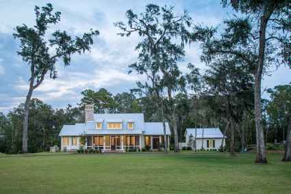 A spacious vacation home in South Carolina's Lowcountry, nestled amidst the lush green landscape of Palmetto Bluff