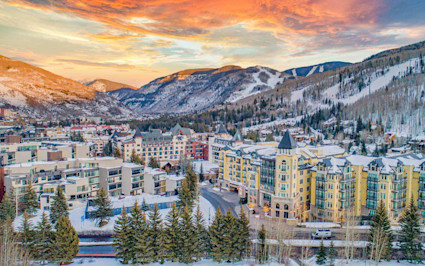 Snowy Vail village with a cozy charm, a scenic highlight often noted in Aspen vs. Vail comparisons.