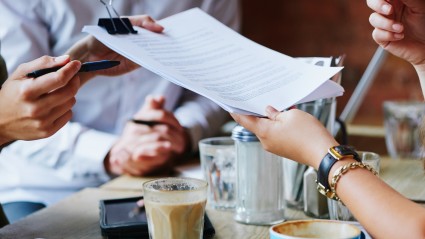 reading documents with coffee