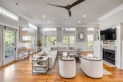 Interior of a living room featuring a ceiling fan and a stylish couch