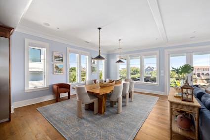 An inviting dining space at Charleston Blvd on Isle of Palms, designed for effortless entertaining and inspired by Charleston’s upscale coastal style. Perfect for hosting seafood dinners during the vibrant summer months.