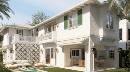 White two-story home with green shutters, outdoor lounge seating, lattice-trained vines, and a covered patio opening to the backyard pool.
