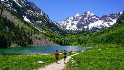 Two people are hiking in Aspen, Colorado, one of the top workcation destinations in the U.S.