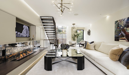 Living room with a coffee table and fireplace.