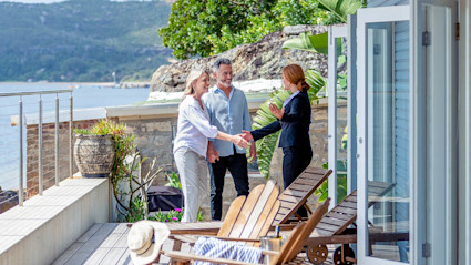 Image of a couple buying a vacation rental. 